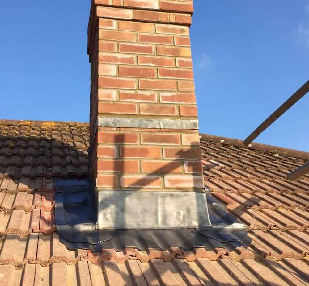 close up of lead flashing around a a chimney